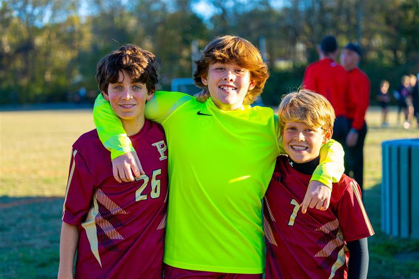 Middle school students play soccer